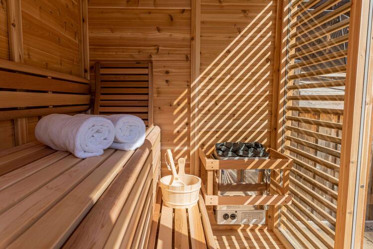 Luxury outdoor sauna interior curved two tier benches Leisurecraft Europe