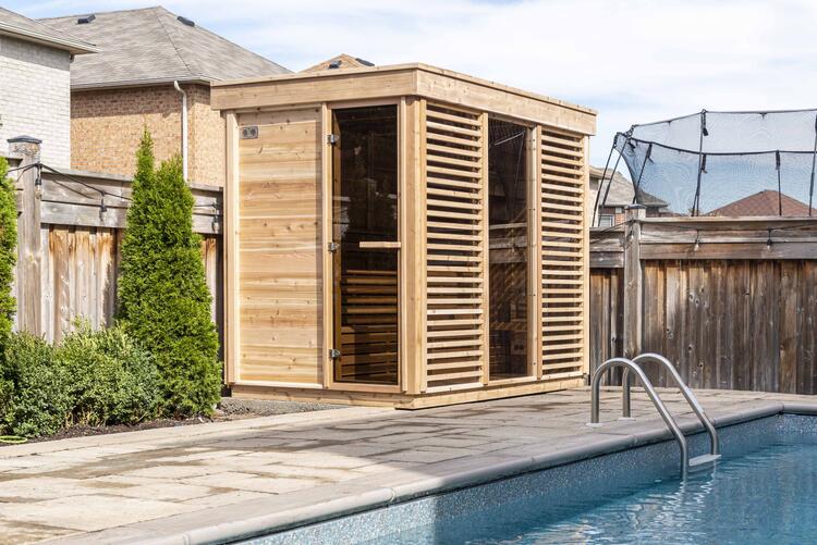 outdoor luxury sauna Pure Cube collection with bronzed tempered door