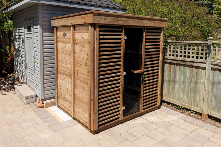 Pure Cube Collection red cedar outdoor sauna with panel windows