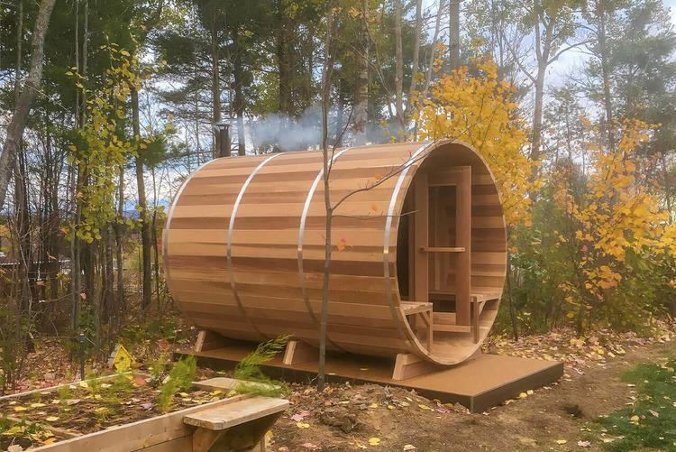 Dundalk-leisurecraft-europe-clear-red-cedar-barrel-sauna-cooling-down-area-front-porch